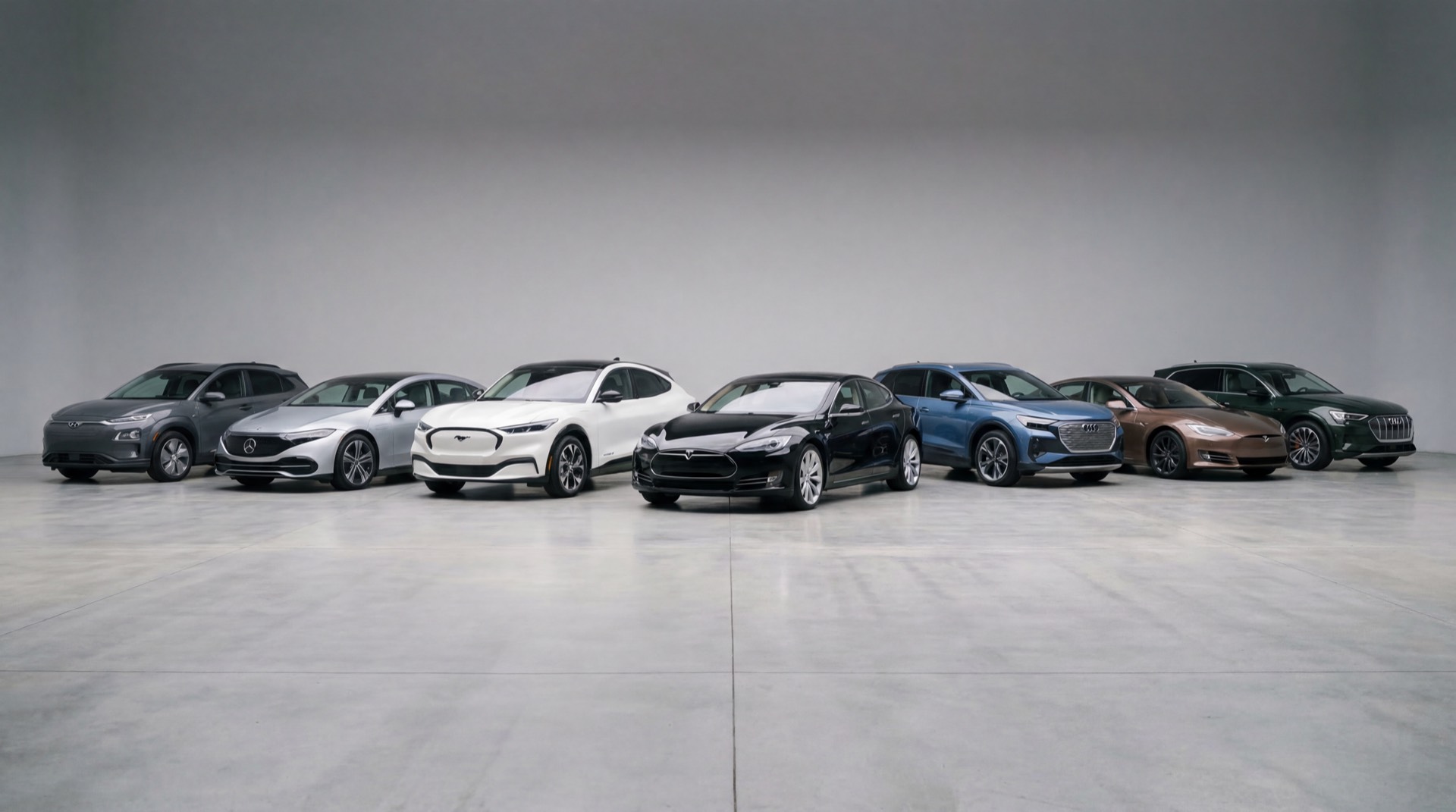 A lineup of modern electric sedans and SUVs in a clean studio setting.